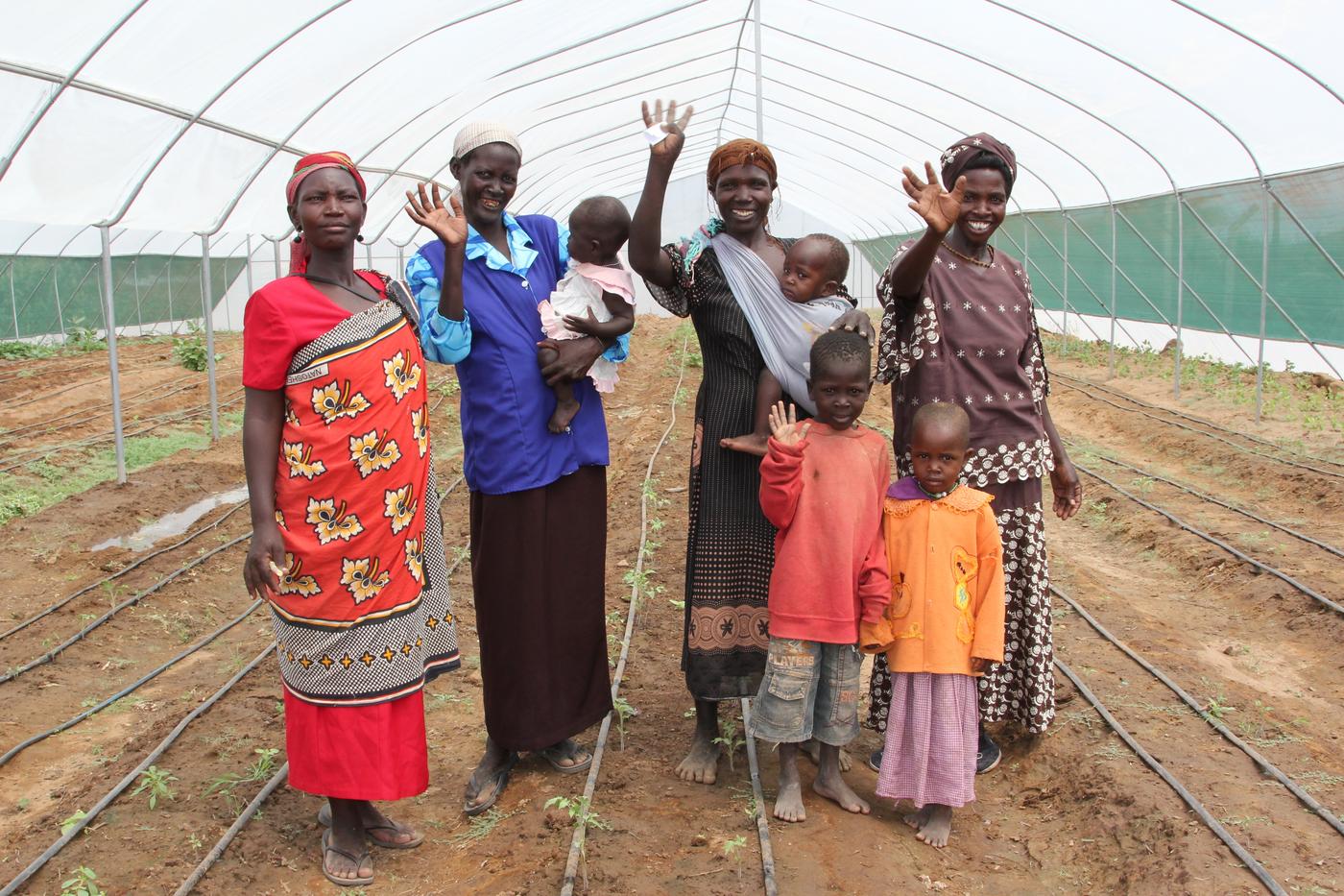 Members of a Kenyan women's community group in a greenhouse