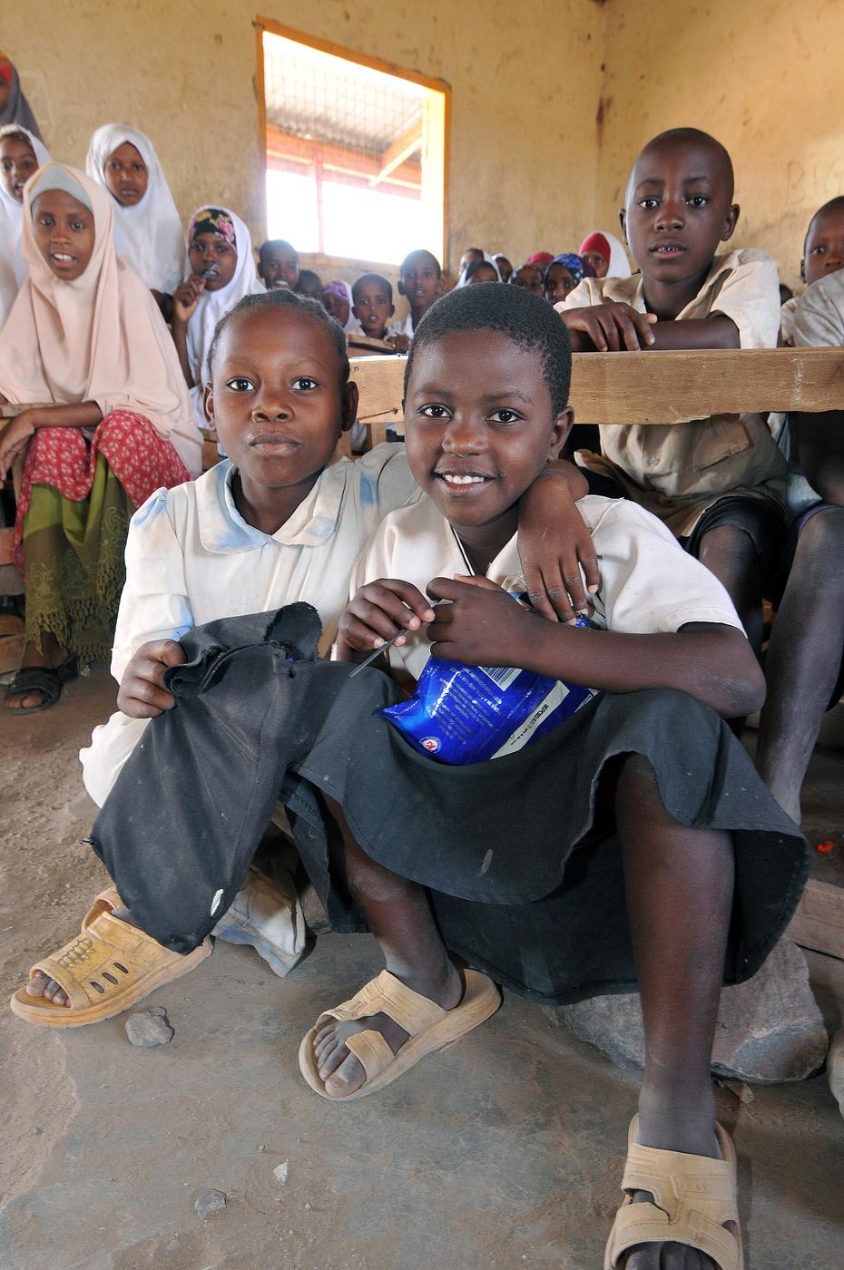 Kenyan schoolchildren seated together in a classroom